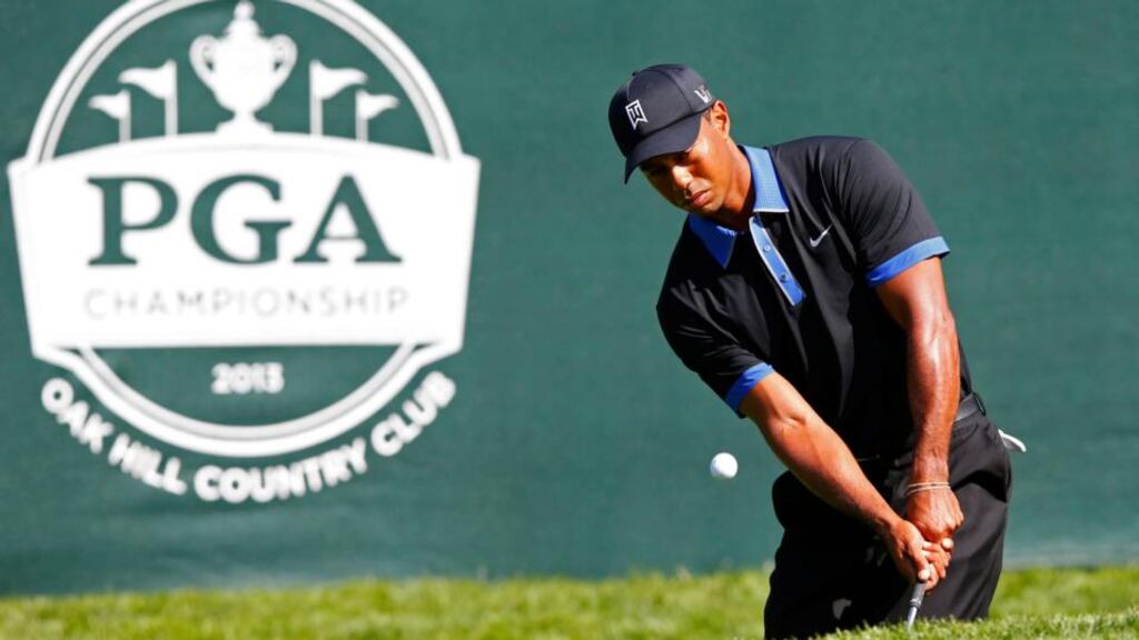 Tiger Woods chips to the second green during a practice round for the US PGA Championship on Monday. Photograph: Jeff Haynes/Reuters