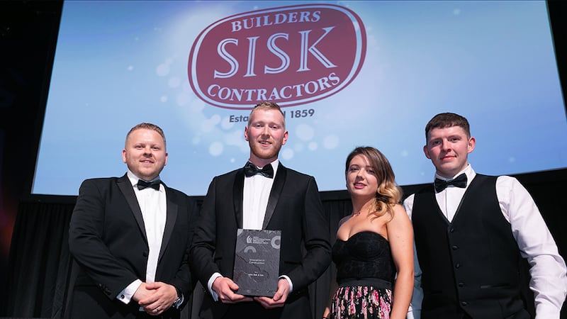Neil Wall, Head of Entries, BusinessRiver, presents the Innovation in Construction award to John Sisk & Son team.