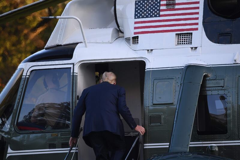 Trump boards Marine One prior to departure  to Walter Reed Military Medical Center. Photograph: Saul Loed/AFP via Getty