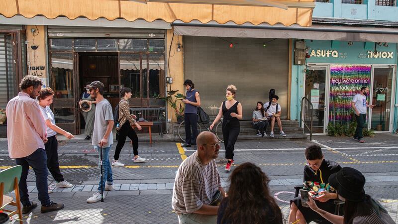 People venture outside in Tel Aviv on May 5th after Israel eased its coronavirus lockdown. It is now battling a resurgence of the virus. Photograph: Dan Balilty/New York Times