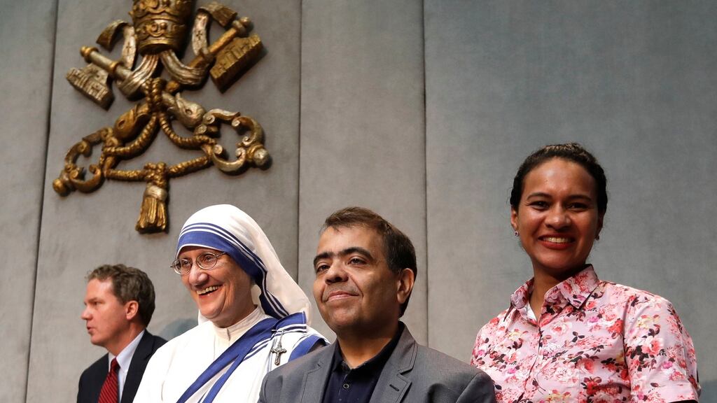 Sr Mary Prema Pierick, superior general of the Missionaries of Charity, Marcilio Andrino (centre) and his wife Fernanda Nascimento Rocha leave  the Vatican on Friday after a press conference. Andrino’s cure of a viral brain infection, declared a miracle by Pope Francis earlier this year, was the final step needed to declare Mother Teresa a saint. Photograph: AP