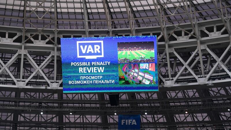 The big screen at the Luzhniki displays a VAR review during the World Cup final. Photograph: Laurence Griffiths/Getty