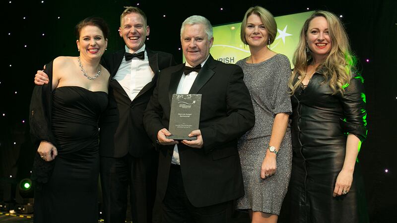 Jim O'Toole, Principal, sportsinterim.com, presents the Best Low Budget Sponsorship award to the Post TV & TG4 team.