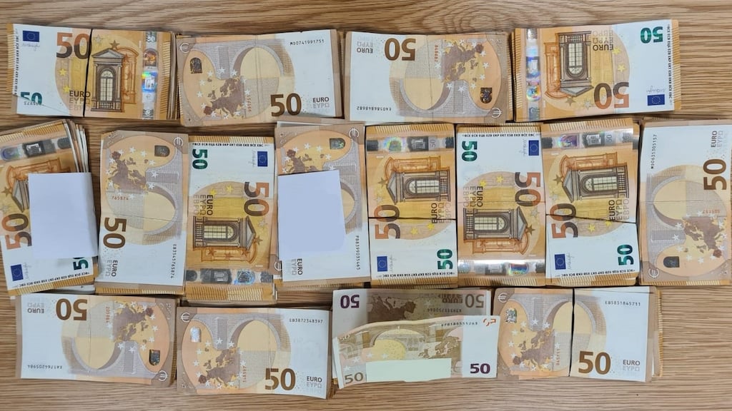 Some of the cash seized by gardaí in a series of raids on Thursday. Photograph: An Garda Síochána