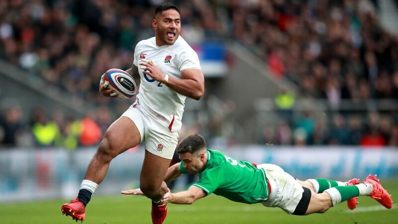England’s Manu Tuilagi gets away from Ireland’s Conor Murray at Twickenham. Photograph: Adam Davy/PA Wire