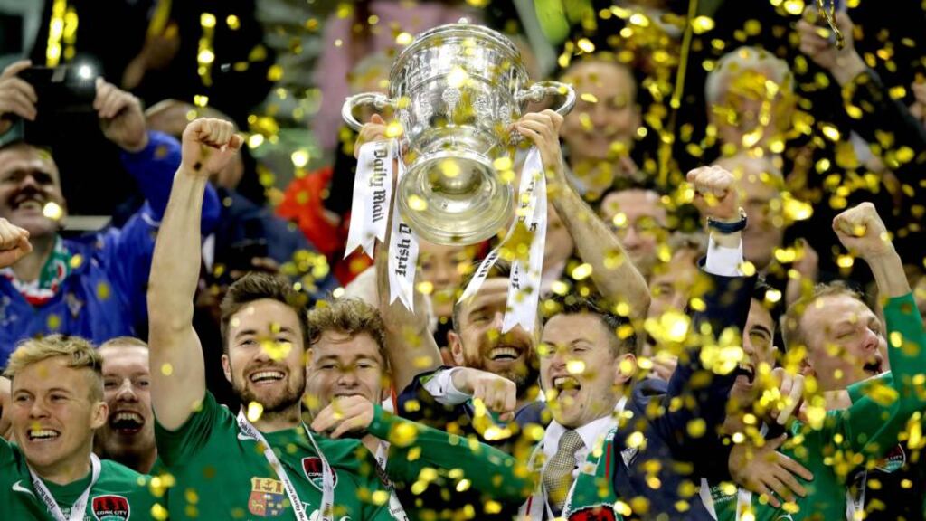 FAI Cup: Cork City’s Alan Bennett lifts the trophy after their penalty shoot-out against Dundalk at the Aviva Stadium. Photograph: Ryan Byrne/Inpho