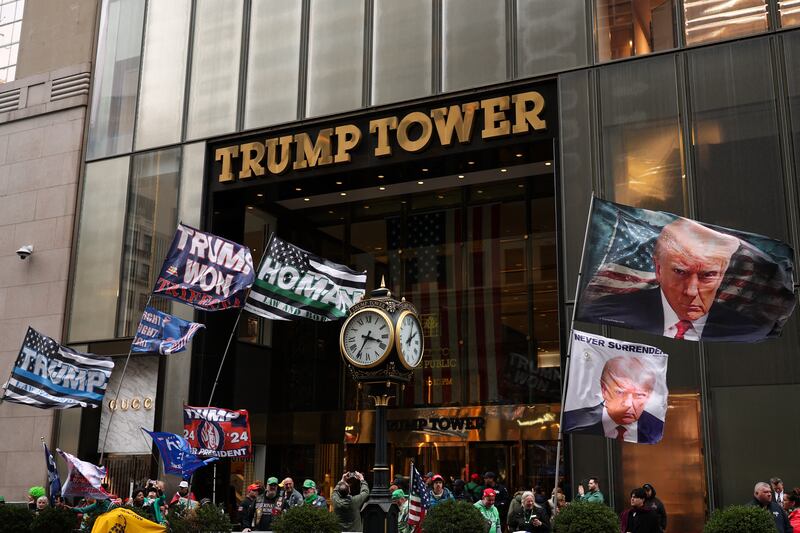 Supporters of US president Donald Trump gather outside Trump Tower holding flags during the annual St Patrick's Day Parade in New York City. Photograph: Charly Triballeau/AFP via Getty Images