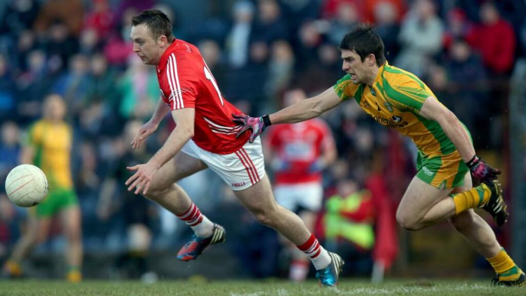 Cork’s Paul Kerrigan gets a step on Donegal’s Paddy McGrath in the Allianz Football League Division 1 match at Páirc Uí Rinn. Photograph: Donall Farmer