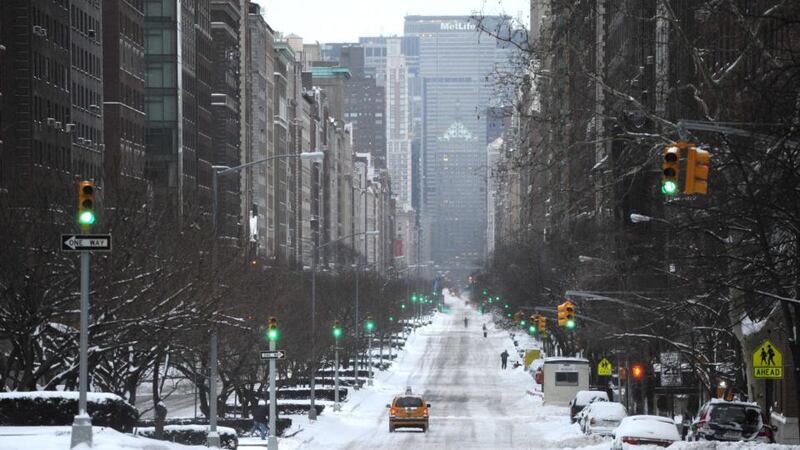 A view down a nearly deserted Park Avenue during what is normally a crowed morning rush hour. Photograph: Stan Honda/AFP/Getty Images
