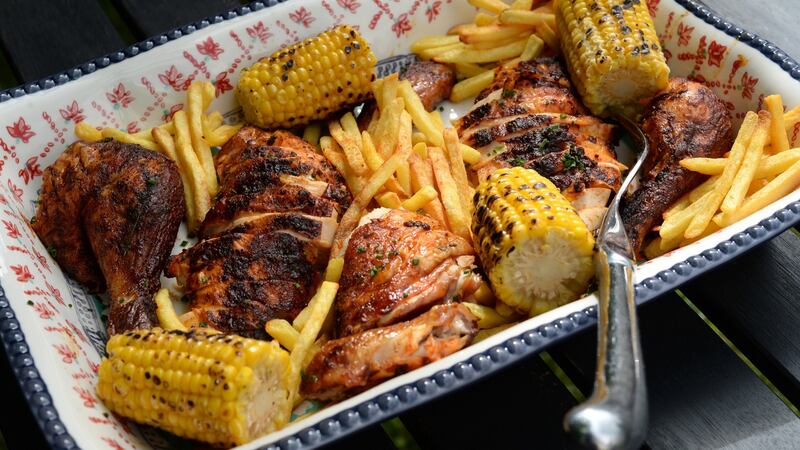 Delicious: barbecued piri-piri chicken with chips and chargrilled corn. Photograph:  Dara Mac Donaill