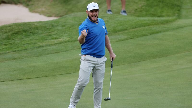 Europe’s Tyrrell Hatton celebrates after holing a birdie putt on the 18th hole to tie the fourball match alongside Jon Rahm against Bryson DeChambeau and Scottie Scheffler of the United States at the Ryder Cup at Whistling Straits in Kohler, Wisconsin. Photograph: Patrick Smith/Getty Images