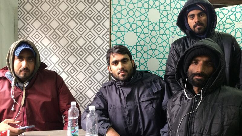 Asnar Emen (24), second from left, from Pakistan at the Refugee Aid Miksaliste centre in central Belgrade. He and his friends want to get to Italy. Photograph: Daniel McLaughlin