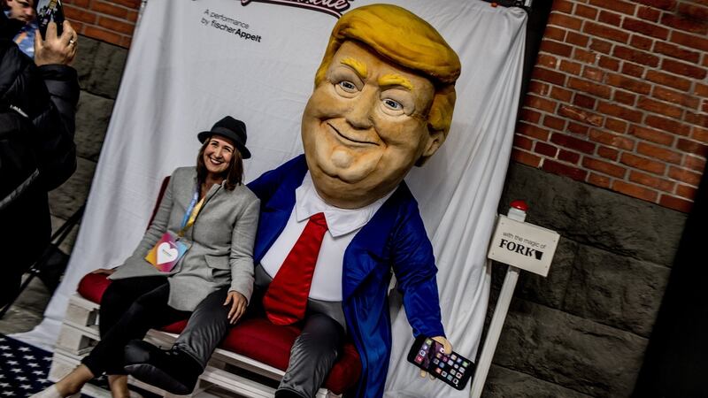 A visitor poses for a photo with an effigy of US president Donald Trump during Re:publica in Berlin in May. Photograph: Filip Singer/EPA