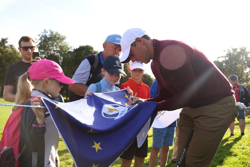 Rory McIlroy signs a Ryder Cup Europe flag for fans at The K Club in Straffan. Photograph: Oisin Keniry/Getty Images