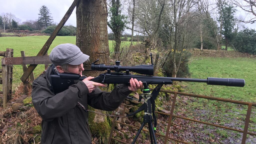Catherine Cleary takes a shot at an inanimate target at the end of a day of deer hunting.