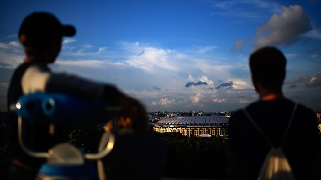 Visitors on Vorobyovy Hills enjoy the view of the Luzhniki Stadium in Moscow ahead of the World Cup semi-final between England and Croatia. Photograph: Matthias Hangst/Getty Images