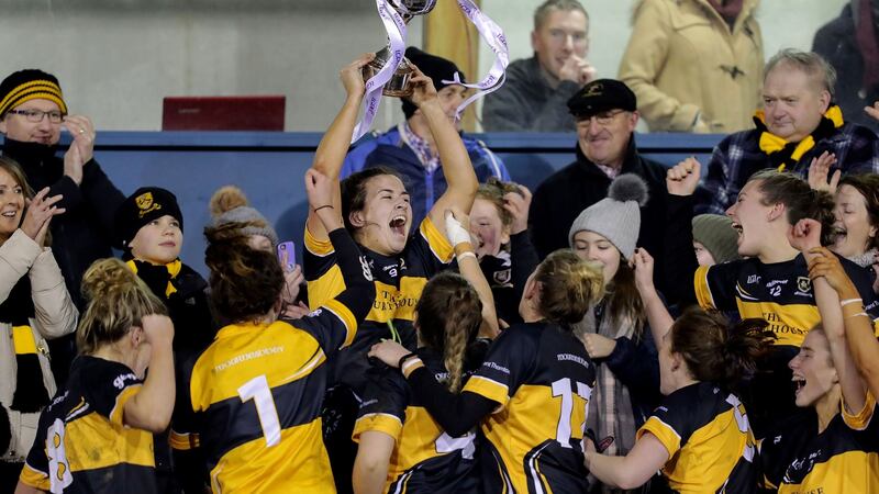 Mourneabbey captain Bríd O’Sullivan holds up the cup. She was one of seven O’Sullivans on the team, presenting TG4’s Brian Tyers with a commentating challenge. Photograph: Laszlo Geczo/Inpho