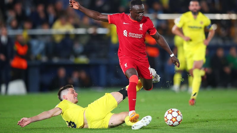 Liverpool’s Sadio Mane evades a tackle from Juan Foyth of Villarreal before scoring his side’s third goal during the Champions League semi-final second leg at the Estadio de la Cerámica. Photograph: Eric Alonso/Getty Images