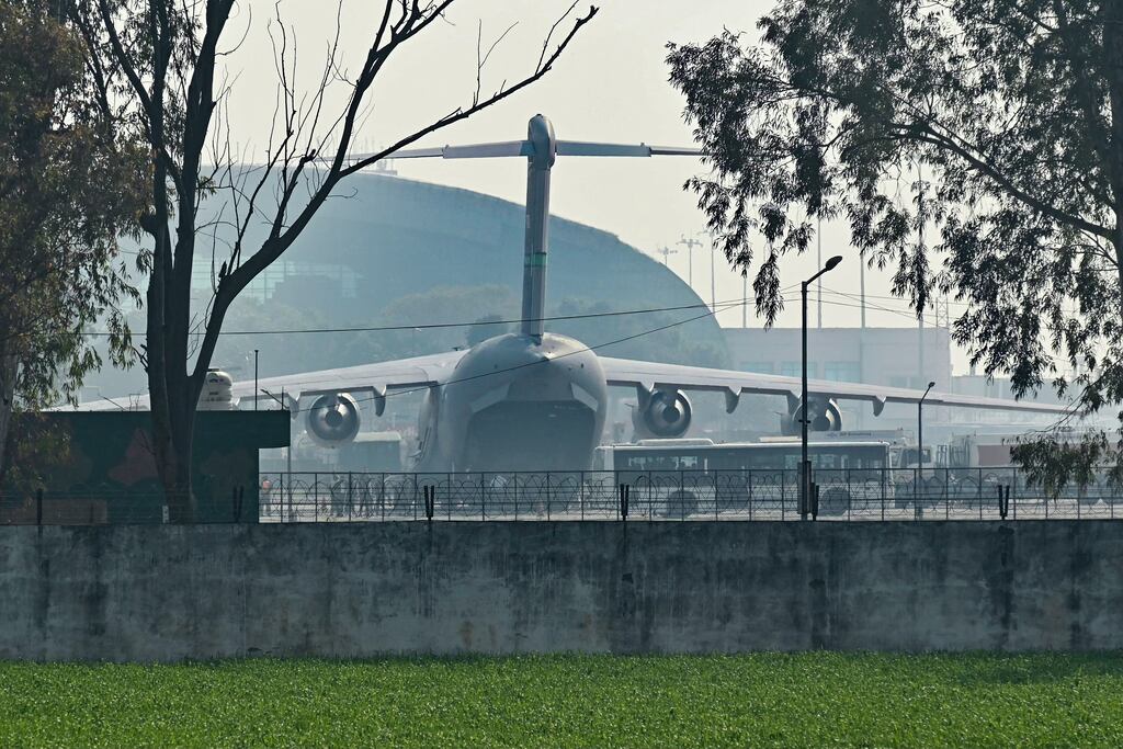 A US military aircraft carrying Indian illegal migrants deported from the United States, lands in Amritsar on Wednesday. Photograph: Narinder Nanu/AFP via Getty Images