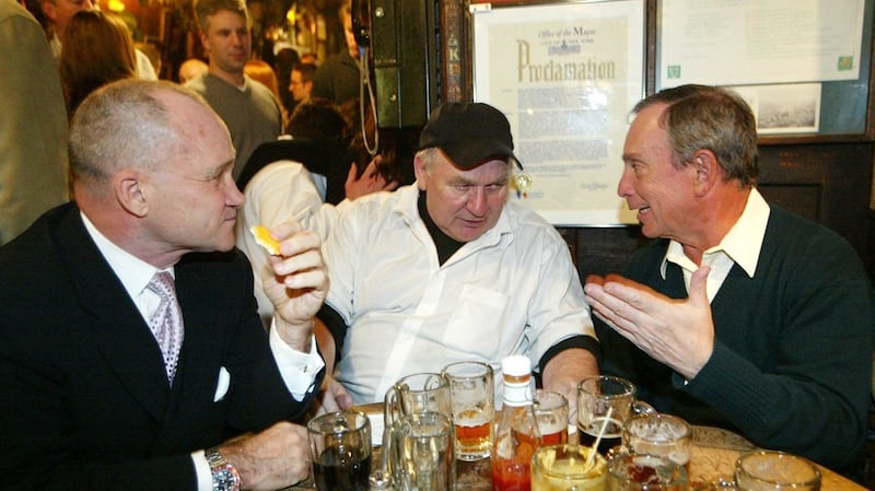 Matty Maher, centre, with New York City police commissioner Raymond W Kelly, left, and mayor Michael R Bloomberg in 2004, during a celebration of McSorley’s 150th anniversary. Photograph: Kristen Artz/AP