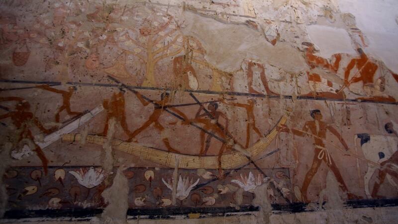 A cameraman films wall paintings in the tomb of a high-ranking female official known as Hetpet, of the 5th Dynasty of ancient Egypt, on the Giza plateau on the southern outskirts of Cairo. Photograph: Khaled Elfiqi/EPA