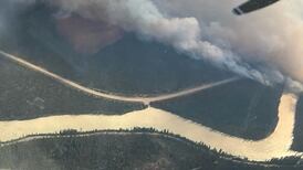 Wildfires burn down part of Jasper in Canada as thousands evacuated in California