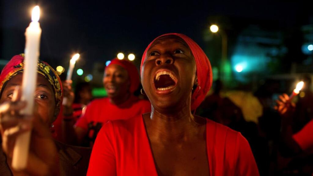A woman shouts during a vigil in Abuja today calling for the release of Nigerian schoolgirls abducted in the remote village of Chibok. Photograph: Joe Penney/Reuters