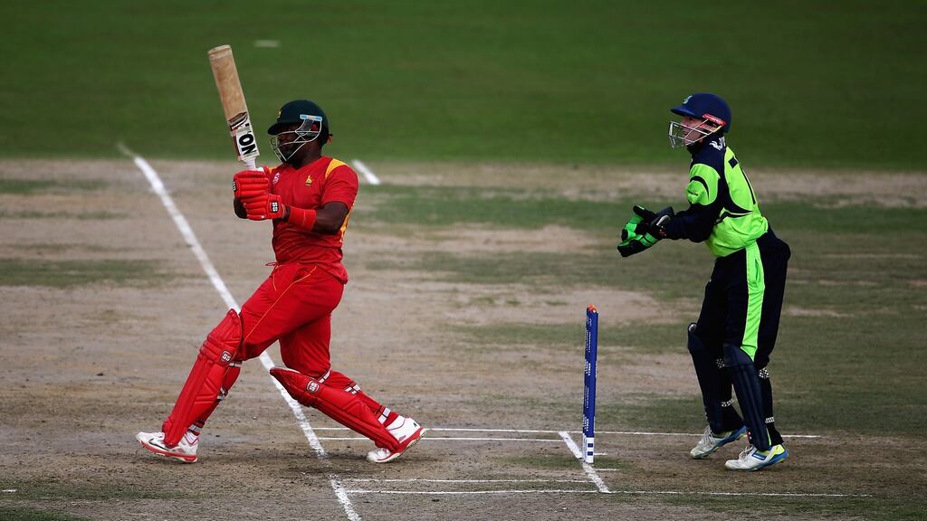 Hamilton Masakadza, captain of Zimbabwe hits the ball towards the boundary, as Niall O’Brien of Ireland looks on during the ICC Twenty20 World Cup warm-up match at the HPCA Stadium. Photograph:  Matthew Lewis-IDI/IDI via Getty Images
