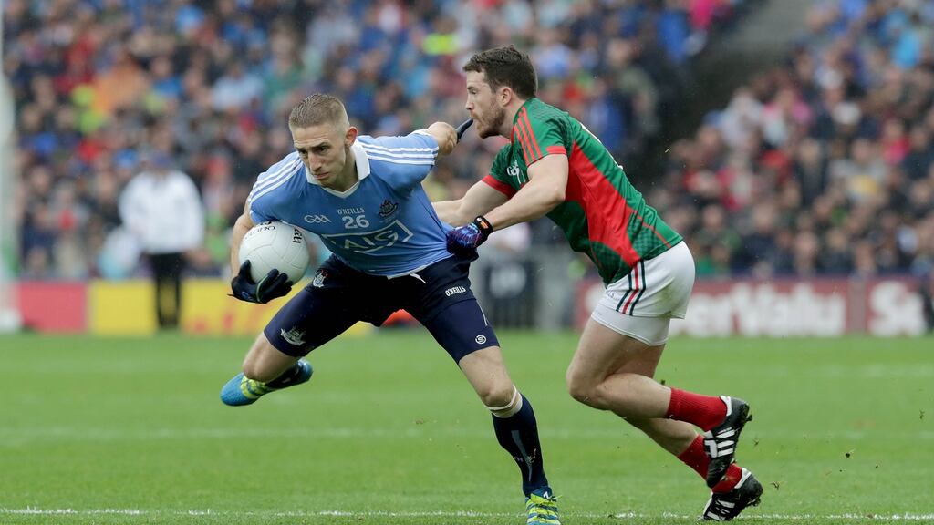 Eoghan O’Gara in action against Chris Barrett of Mayo in the All-Ireland final. The Dublin forward had to contend with limited playing time this year. Photograph: Morgan Treacy/Inpho