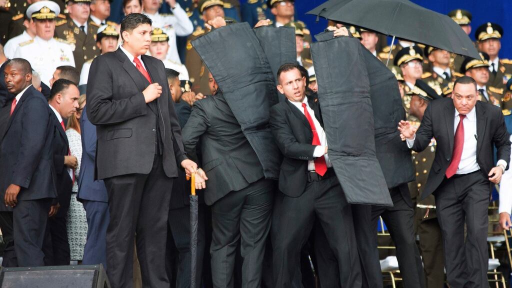 Security personnel surround Venezuela’s president Nicolas Maduro following a drone blast in Caracas, Venezuela. Photograph: Xinhua via AP