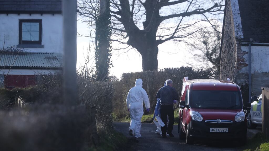 Forensic officers at the scene of a major incident at a farmhouse in Bankhall Road, Larne, Co Antrim. Photograph: Niall Carson/PA Wire