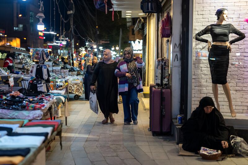 Iraqis shop in Baghdad's busy Karada neighbourhood last month. Photograph: Joao Silva/New York Times