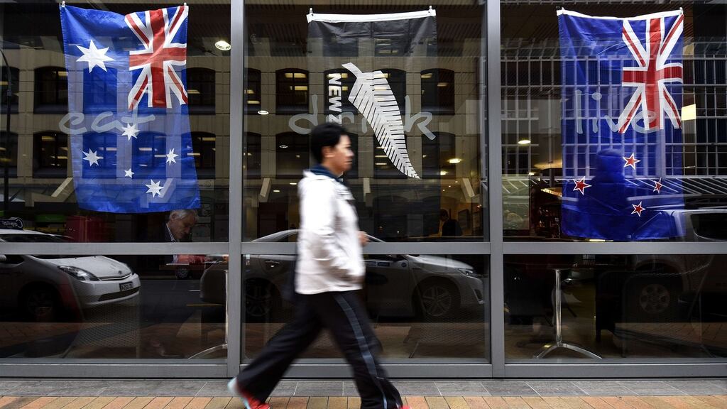 Which is which? A bar window in Wellington displays the Australian (left), the All Blacks rugby team flag (centre) and the New Zealand flag (right) ahead of the Rugby World Cup final on Saturday. Photograph: Marty Melville/AFP/Getty Images.