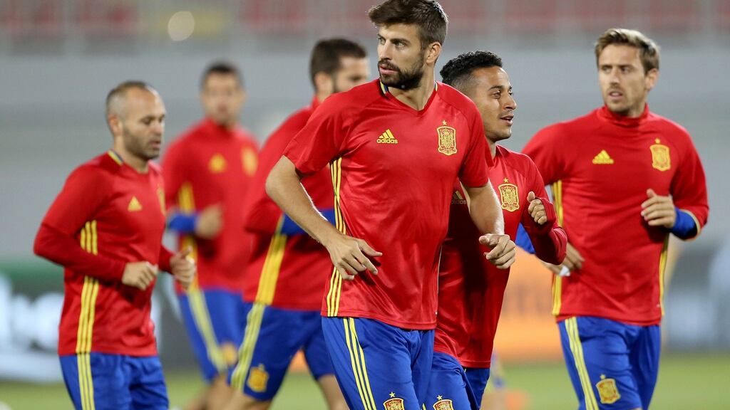 Gerard Pique has been criticsed by Spanish fans for cutting off the sleeves from his shirt which bore Spain’s colours of yellow and red. Photograph: Getty Images/Inpho