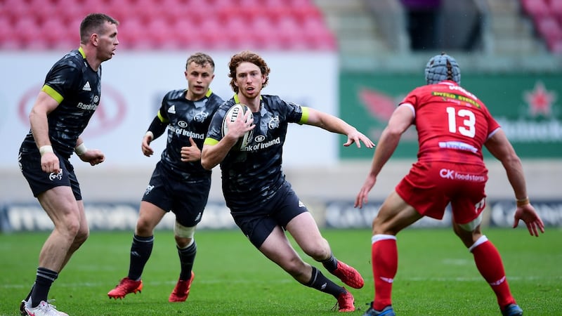 Munster’s Ben Healy comes up against Jonathan Davies of Scarlets. Photograph: Ryan Hiscott/Inpho