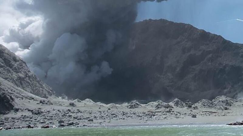 This handout photograph shows the volcano on New Zealand’s White Island spewing steam and ash following an eruption on Monday. Photograph: Michael Schade via Getty Images