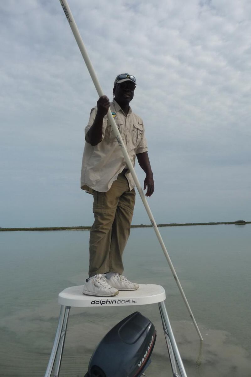 Resident Gillie Ishi, slowly and silently sculling the 17ft stiff-pole as he peers the shallows for bonefish
