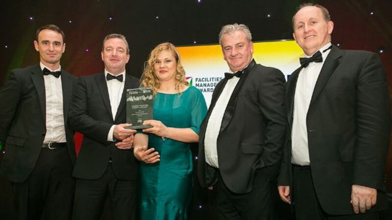 David Norton, Key Account Manager, Essity Ireland presents the Innovation in Technology & Systems - End Users award to BAM Facilities Management Ireland Team