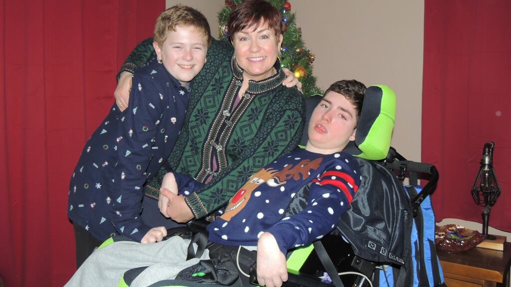 Tracy McGinnis with her sons Declan and Brendan, who requires constant care