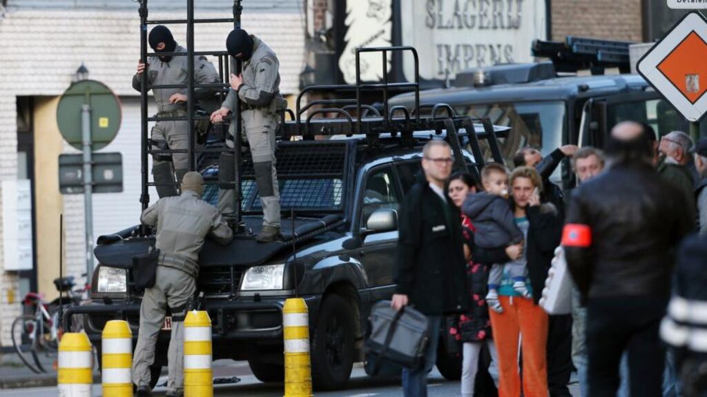 Belgian police cordoned off part of the city after four men were seen entering a building in the Dampoort district. Photograph: Francois Lenoir/Reuters
