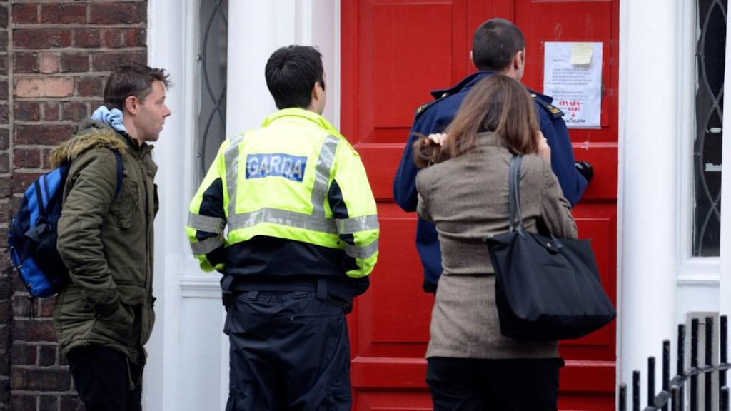 Staff members with gardaí outside Leinster College language school last week when it announced it was closing temporarily. Today the college announced it had ceased trading. Photograph: Dave Meehan