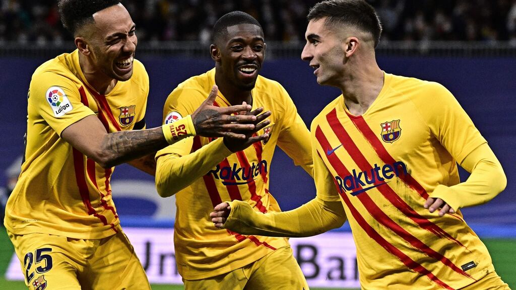Barcelona’s Ferran Torres celebrates with Pierre-Emerick Aubameyang and Ousmane Dembele after scoring for the Catalan club in the Spanish capital. Photograph: Getty Images