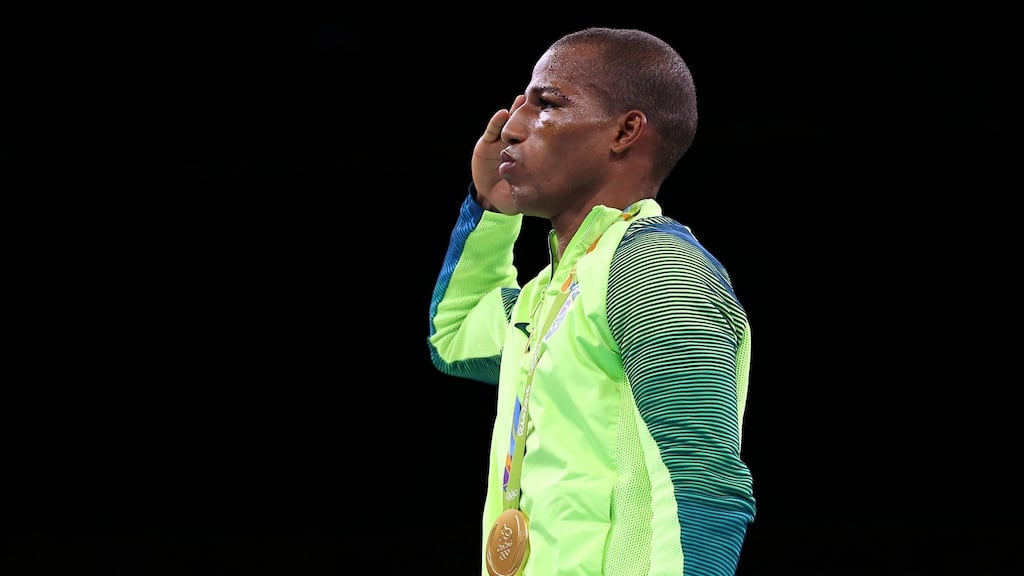 Gold medalist Robson Conceicao of Brazil stands at attention during the playing of the anthem. Photograph: Peter Cziborra/Reuters