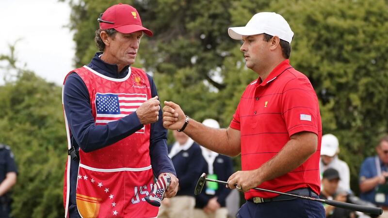 Swing coach Kevin Kirk caddied for Patrick Reed on the final day of the presidents Cup. Photograph: Scott Barbour/EPA