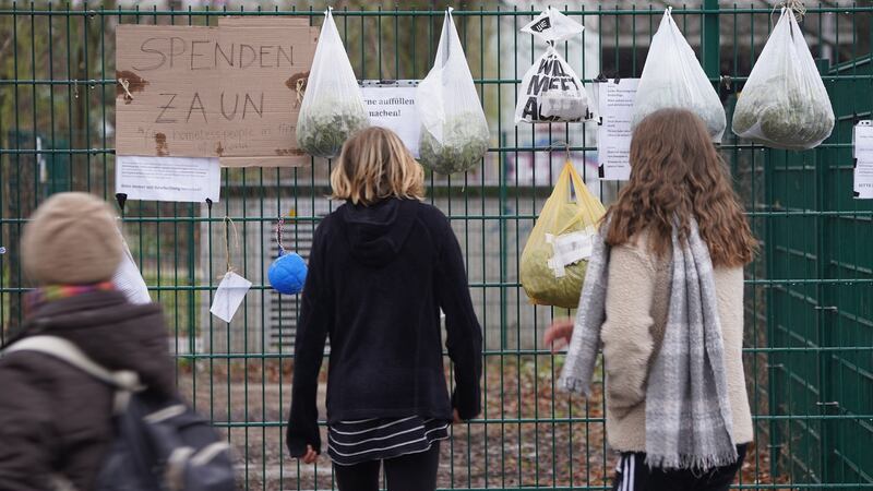 Donations for the homeless hang from a fence in Berlin on March 30th. Many of these donations fences have been springing up in cities across Germany. Photograph: Sean Gallup/Getty Images