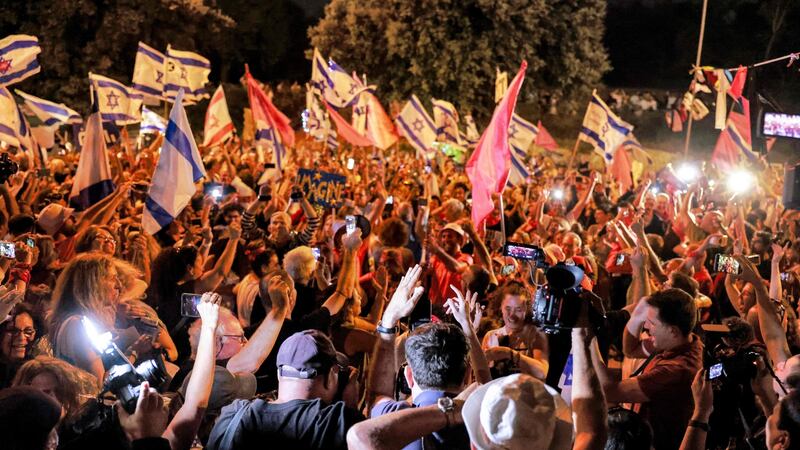 Israelis celebrate the passing of a vote confirming a new coalition government during a rally in front of the Knesset during a parliamentary vote, in Jerusalem on June 13th. Photograph: Menahem Kahana/ AFP via Getty
