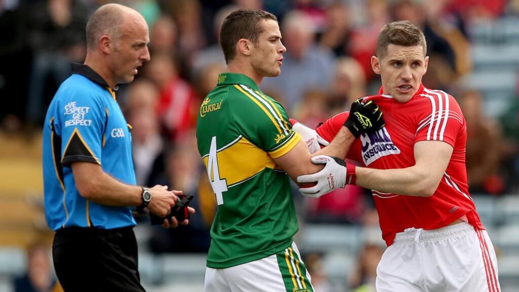 Kerry’s Shane Enright and Daniel Goulding of Cork clash during the Munster senior football final at Páirc Uí Chaoimh. Photograph: Inpho