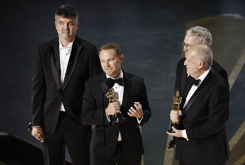 Richard Baneham, (centre) with Eric Saindon, Daniel Barrett and Joe Letteri after winning the best visual effects Oscar for Avatar: The Way of Water in 2023. Photograph: Etienne Laurent/EPA