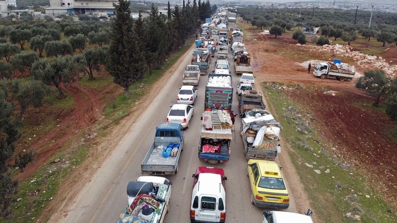 Displaced Syrians drive through the town of Hazano in Idlib’s northern countryside on February 11th  as people flee a pro-regime offensive. Photograph: Aref Tammawi/AFP via Getty Images