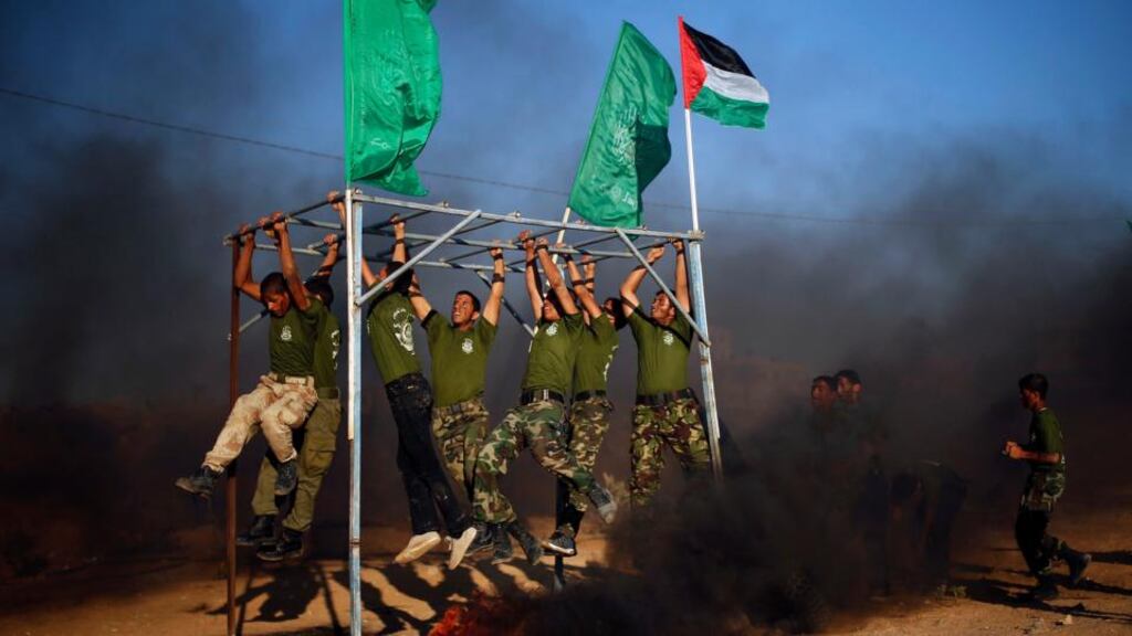 Young Palestinians taking part in a military-style graduation ceremony organised by Hamas in the southern Gaza Strip. Hamas, a Muslim Brotherhood offshoot, will be considering its options after recent events in Egypt. Photograph: Suhaib Salem/Reuters